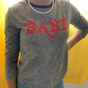 grey long sleeve babe shirt.